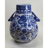 A modern Chinese export blue and white vase, of Hu form, the shoulders flanked by deer mask handles,