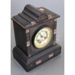 A Victorian black slate and rouge marble eight-day mantel clock, the enamelled chapter ring