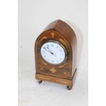 A 19th century rosewood and boxwood inlaid mantel clock, of lancet form, the enamel dial showing