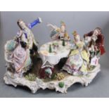 A large Sitzendorf porcelain figure group, in the Rococo taste, showing five diners toasting, w.