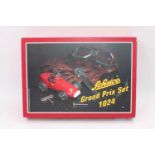 A Schuco Set No. 1024 Ferrari Grand Prix gift set of tinplate construction, housed in the original