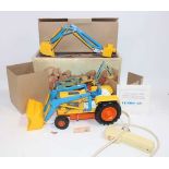 Clim of Spain, tinplate, and plastic battery-operated model of an excavator, finished in yellow,
