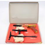 A boxed Cresent Luger pistol with a silencer, telescopic sight and shoulder butt, all in the