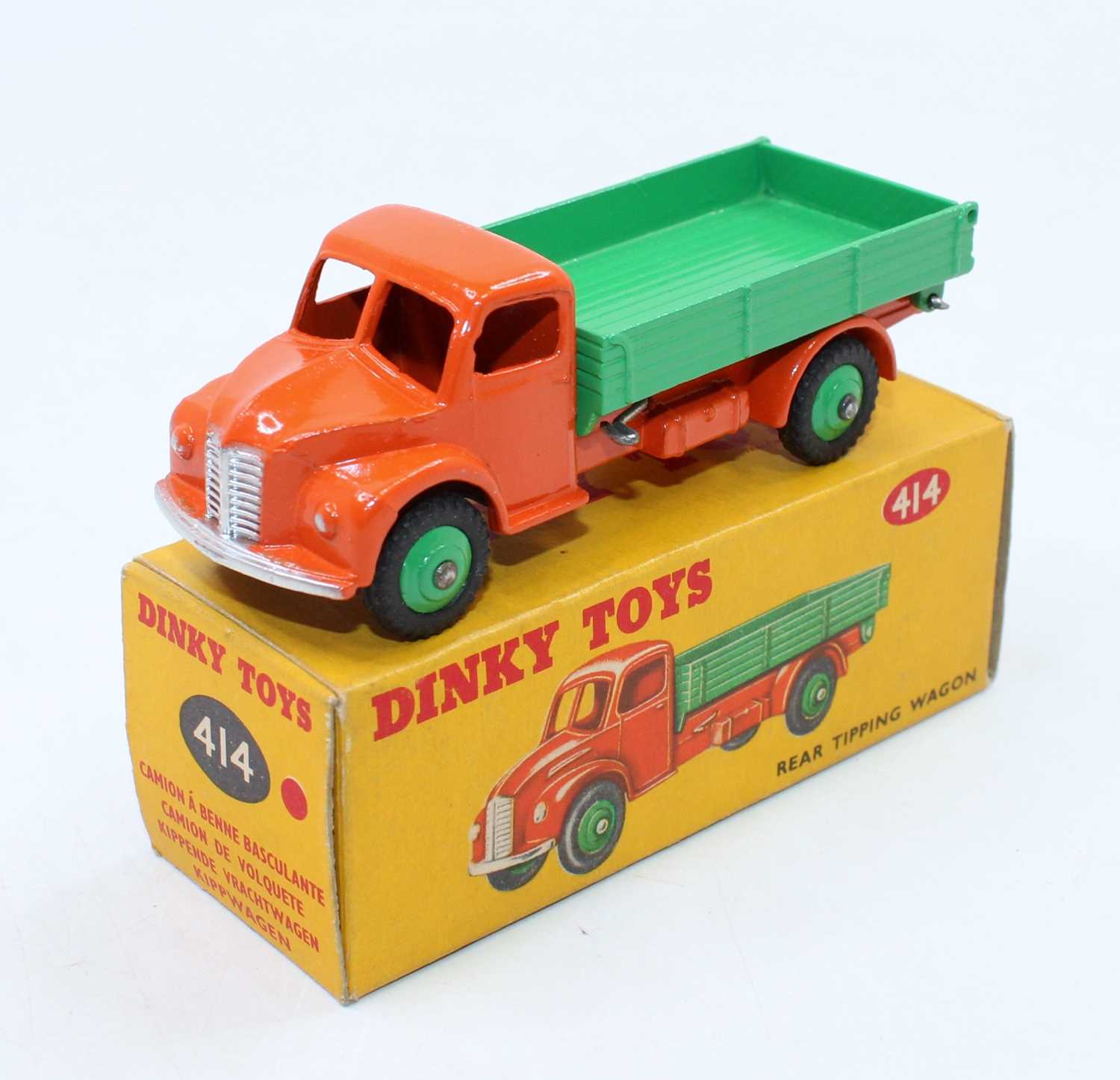 Dinky Toys, 414, Rear Tipping Wagon, orange chassis, green hubs and back, in the original all card