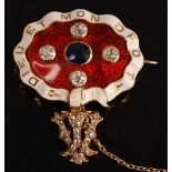 A yellow metal, sapphire and diamond enamel brooch, comprising an oval panel in red guilloche enamel