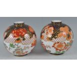 A pair of Victorian Royal Crown Derby vases, each of globular form, decorated in the Imari palette