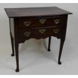 A George III oak side table, having a two-plank top with moulded edge above two frieze drawers, each