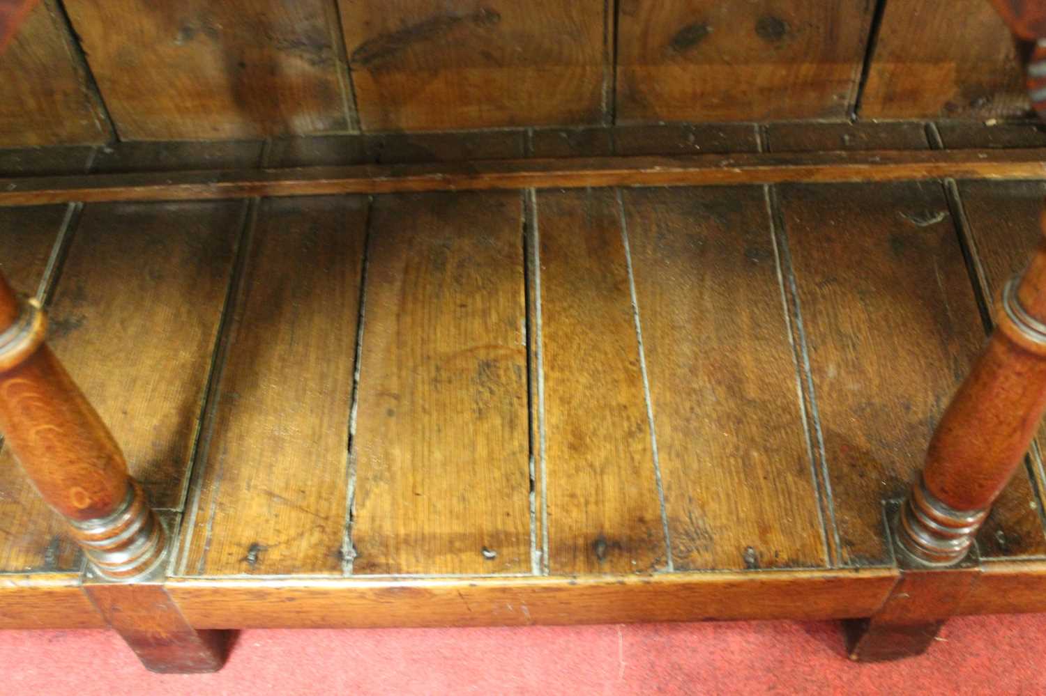 An 18th century oak dresser, the upper section having a two-tier plate rack with ironmongery to each - Image 8 of 13
