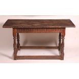 An 18th century joined oak refectory table, of small proportions, having a four plank top with