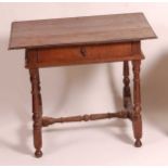 An early 18th century joined oak single drawer side table, of small proportions, the planked top