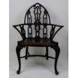 A Victorian elm seat and fruitwood Gothic influence Windsor chair, having dish seat and crinoline