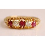 An Edwardian 18ct yellow gold, ruby and diamond five stone half hoop eternity ring, featuring