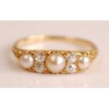 A yellow metal, pearl and diamond seven-stone half hoop eternity ring, comprising three graduated