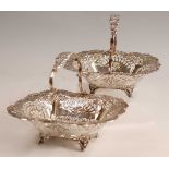 A pair of late Victorian silver sweetmeat baskets, of pierced rectangular form and on scrolling