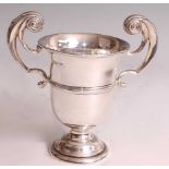 An Edwardian silver pedestal trophy cup by Walker & Hall, having plain banded body to a stepped
