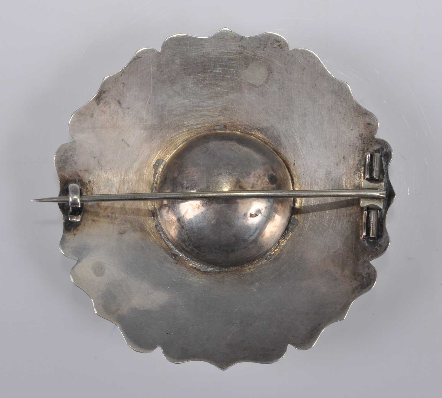 A white metal large circular Celtic brooch, engraved with scrollwork and chequerboard pattern, - Image 2 of 2