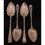 A matched set of four George III silver berry spoons, in the Hanoverian pattern, the gilt-washed