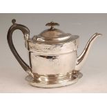 A George III silver teapot and stand, the teapot of oval tapering form, the body bright cut engraved