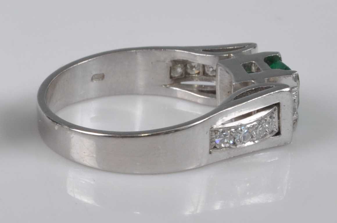 A white metal, synthetic emerald and diamond ring, comprising a centre octagonal cut synthetic - Image 2 of 3