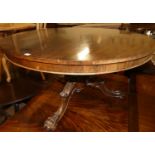 An early Victorian rosewood pedestal breakfast table, having a circular tilt top to a turned and