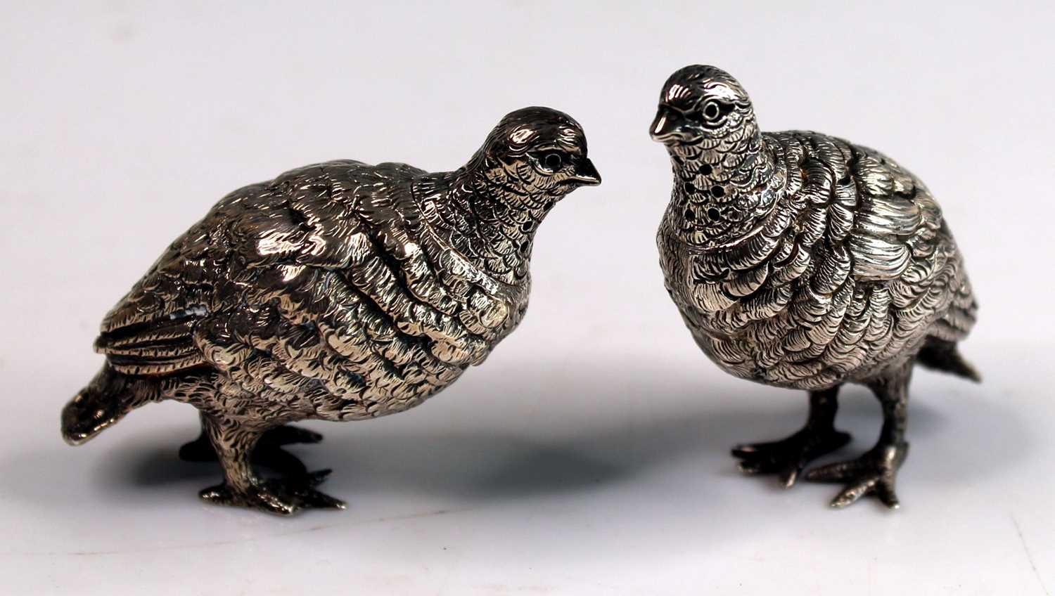 A pair of Victorian novelty silver salt and pepper cruets modelled as standing grouse, with