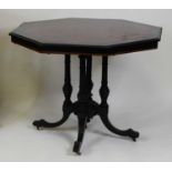 A late Victorian Aesthetic Movement ebonised and amboyna centre table, of octagonal form, having