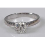 An 18ct white gold diamond solitaire ring, featuring a round brilliant cut diamond in a four-claw