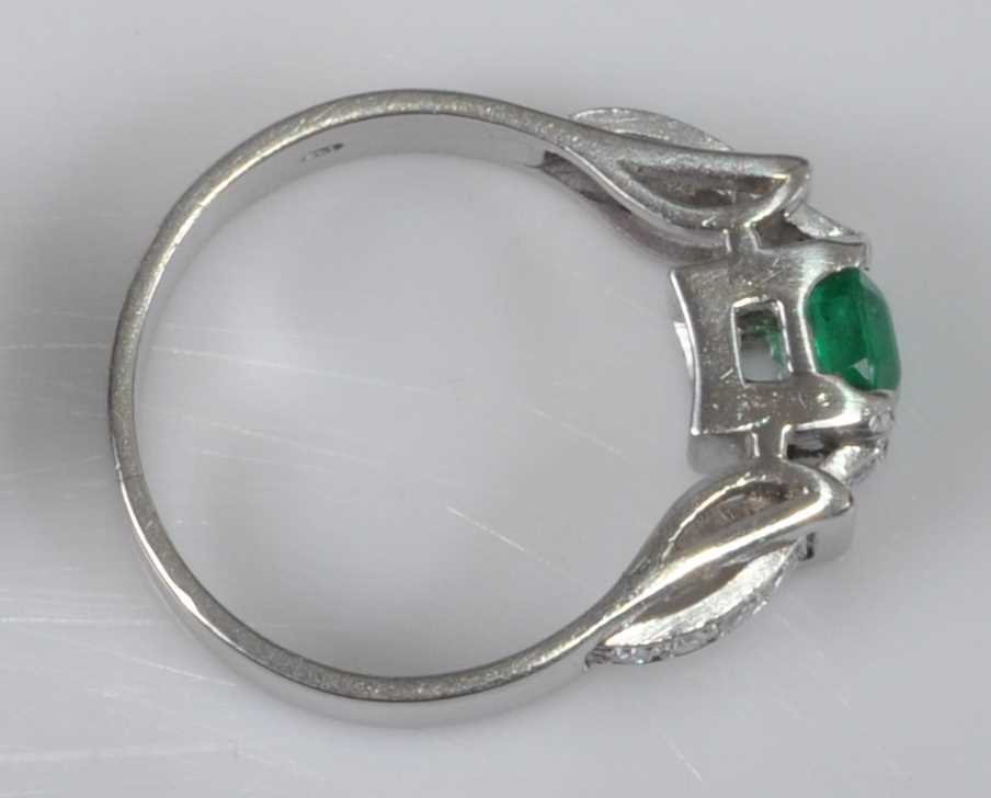 A white metal, synthetic emerald and diamond ring, comprising a centre octagonal cut synthetic - Image 3 of 3