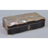 A late Victorian tortoiseshell and mother of pearl ring box, of serpentine outline, having velvet