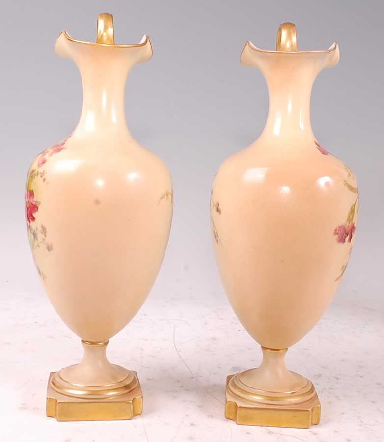 A pair of Edwardian Royal Worcester porcelain pedestal ewers, hand-painted floral decoration on a - Image 2 of 17