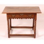 A circa 1700 joined oak side table, having a two-plank top with a moulded edge over single frieze