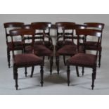 A set of eight William IV mahogany barback dining chairs, each having tulip moulded centre rails,
