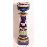 A Victorian majolica pedestal jardiniere in the manner of George Jones, decorated with ribbons and