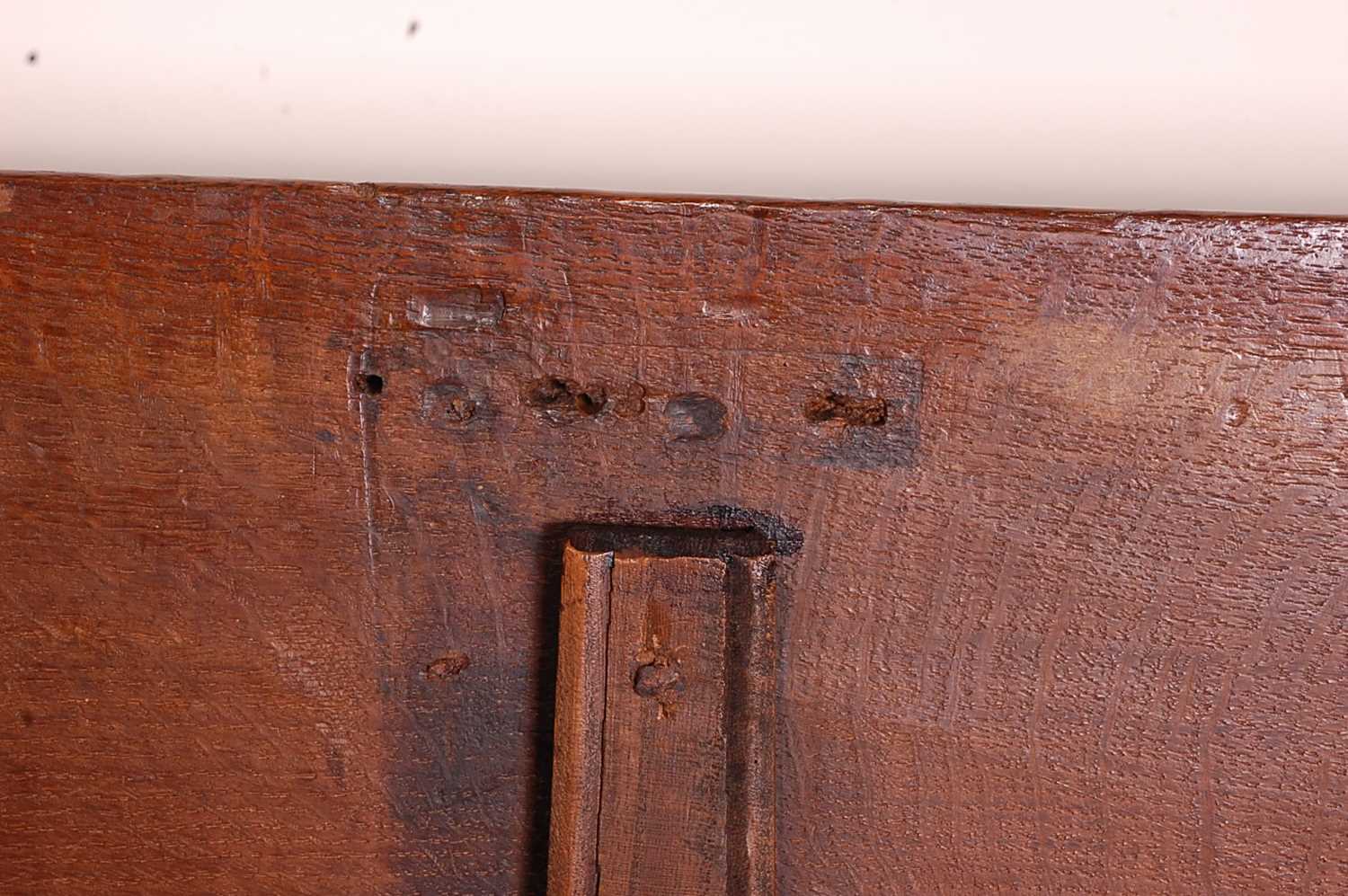 A circa 1700 joined oak four-panel coffer, the two plank top on original steel loop hinges, the - Image 7 of 7