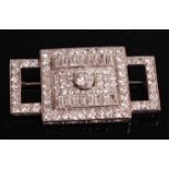 A white metal Art Deco diamond panel brooch, featuring a centre Old European cut diamond within a