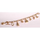 A Links of London 18ct yellow gold oval link bracelet with 9 charms, to include a star, single stone