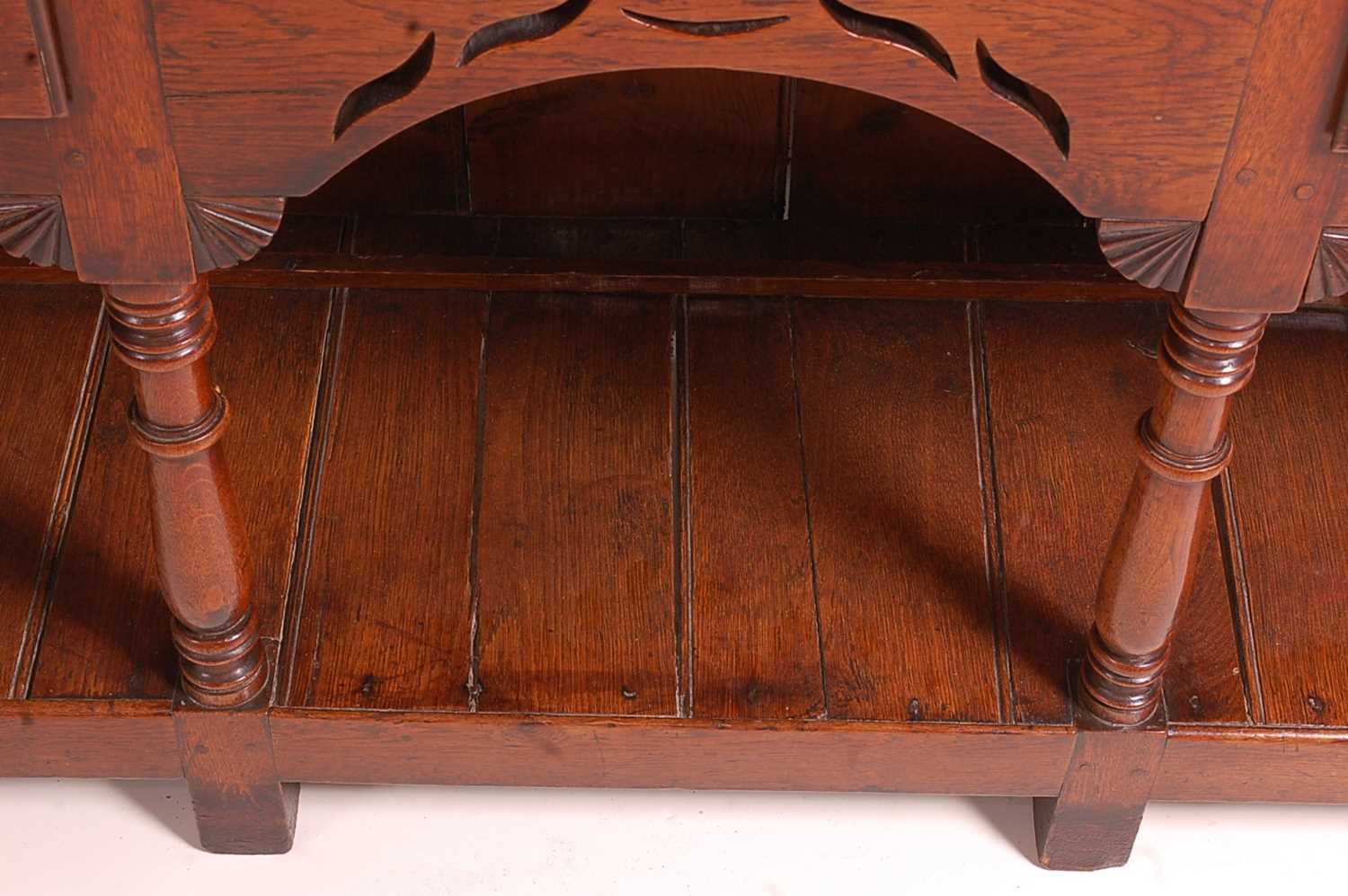 An 18th century oak dresser, the upper section having a two-tier plate rack with ironmongery to each - Image 4 of 13