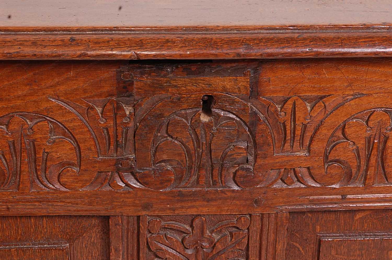 A circa 1700 joined oak four-panel coffer, the two plank top on original steel loop hinges, the - Image 3 of 7