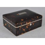 An Edwardian tortoiseshell table cigarette box by Lund of 57 Cornhill, London, having white metal