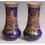 A near-pair of 1920s Carltonware porcelain vases, of lower bellied form with slightly flaring