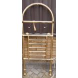 A Cotswold tubular burnished metal towel rail, of arched form, 136 x 57cm