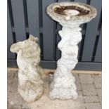 A reconstituted stone bird bath, the column in the form of a standing cherub, h.95cm; together