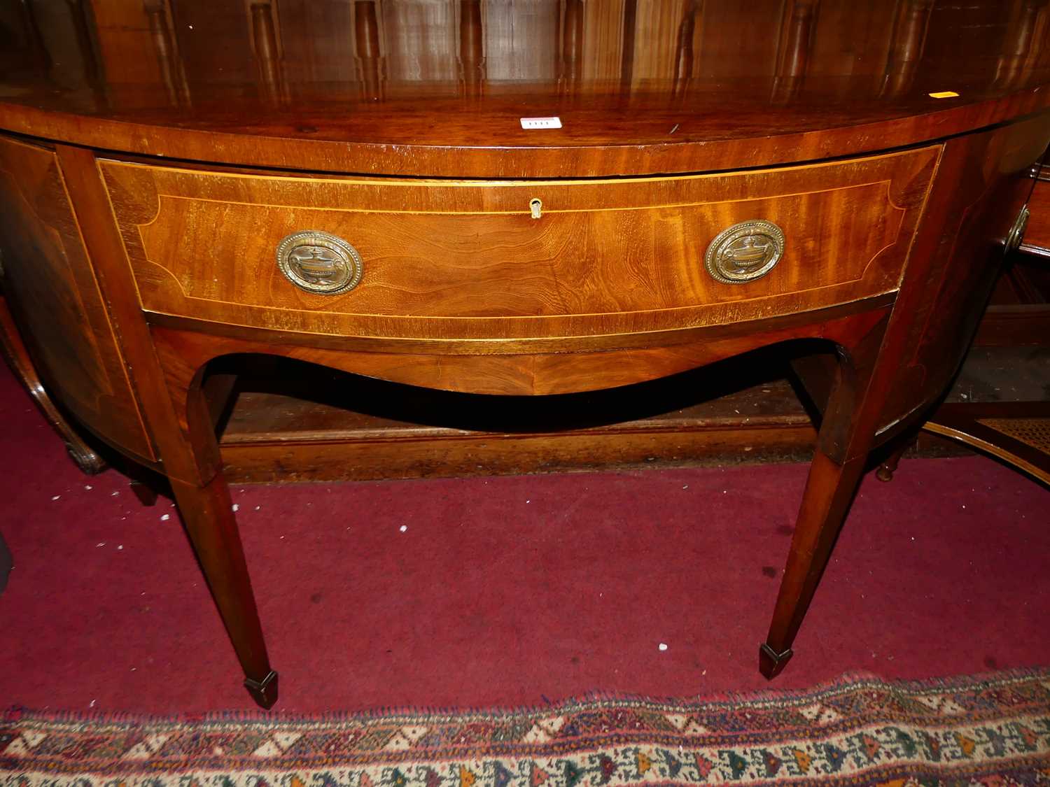 A 19th century mahogany demi-lune sideboard, having single central drawer flanked by cupboard doors, - Image 4 of 5