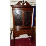 A circa 1900 mahogany, satinwood crossbanded, inlaid and further strung bookcase on stand, the upper