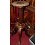 An early 20th century mahogany pedestal sculpture stand, with octagonal rotating top, h.111.