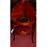 An early 19th century mahogany bowfront two-tier wash-stand, having single central drawer