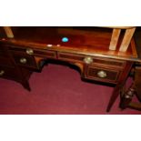 A circa 1900 mahogany and satinwood cross banded kneehole four drawer side table table, raised on