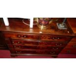 A George III mahogany chest, of two short over three long graduated drawers, on ogee bracket