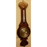 An Art Nouveau oak, satinwood and metal inlaid two-dial aneroid wheel barometer, signed Heath &