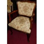 A French style floral needle work upholstered and studded single elbow chair, width 56cm, together